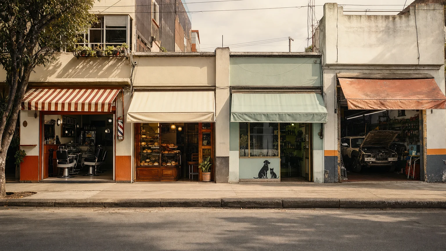 Neighbourhood shopfronts in a row: a barber shop, a bakery, a vet and a mechanic